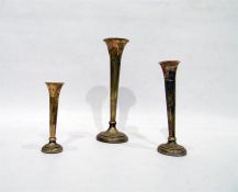 Set of three silver trumpet-shaped flower vases of