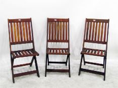 Set of four teak folding garden/patio chairs