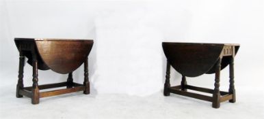 Pair of stained oak drop-leaf side tables on turne