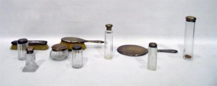 Seven various silver-topped glass trinket jars, a