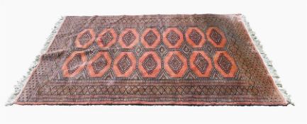 Indian wool rug, pink ground with brown, beige bor