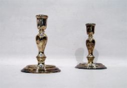 Pair of Georgian style silver candlesticks, the bu