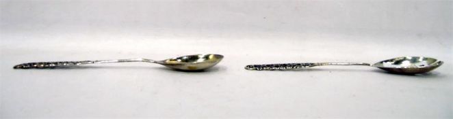 Pair of foreign silver salad servers of open flora