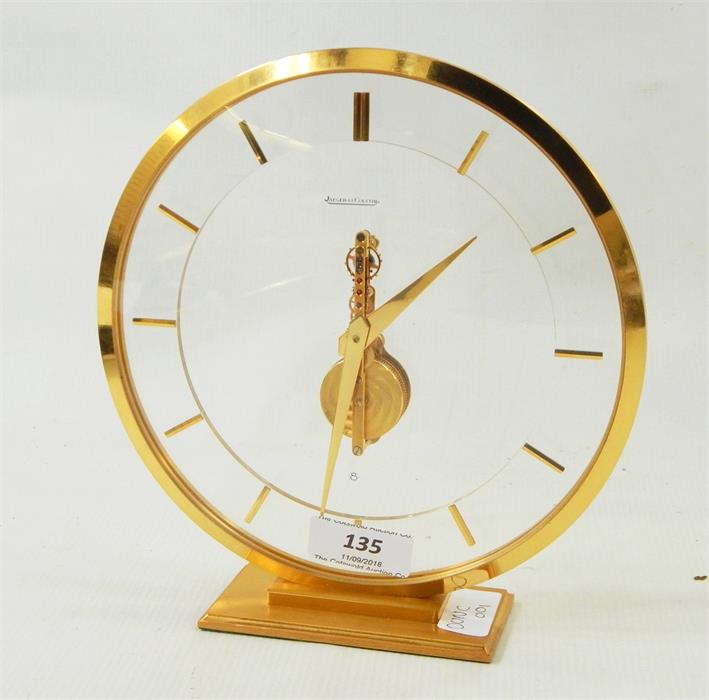 Jaeger Le Coultre modern mantel clock, circular, on a rectangular base, registration number to