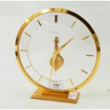 Jaeger Le Coultre modern mantel clock, circular, on a rectangular base, registration number to