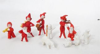 Tin box containing miniature porcelain musical pixies and a miniature Father Christmas