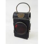 Railway hand lamp, SNLW Limited, plated GR 1941 with red lens and internal burner, 26cm high over