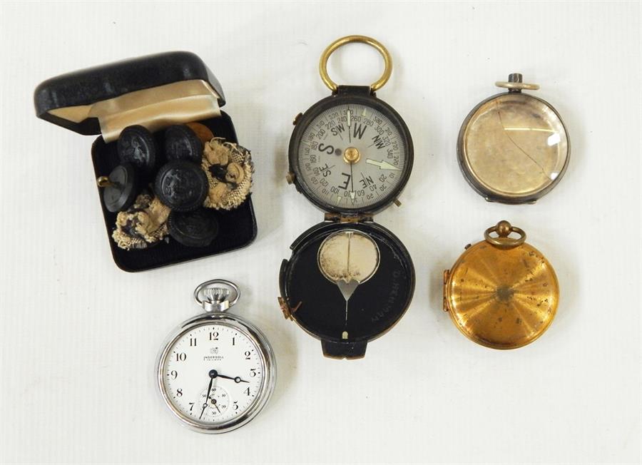 Ingersoll pocket watch, two handheld compasses, watch case and various buttons (1 box)