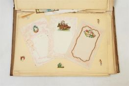 Late Victorian album of stationery, including embossed and chromolithographic cards and writing