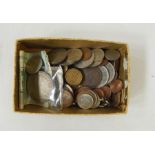 Small box of foreign coins including 1953 South African crown and 1/10th Kimiggram gold and three