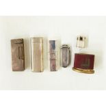 Cartier silver plated lighter, no.98994 with engraved decoration, similar Dunhill lighter, pair