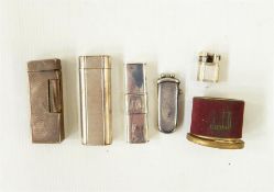 Cartier silver plated lighter, no.98994 with engraved decoration, similar Dunhill lighter, pair