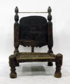 Late 18th/early 19th century Tibetan/Burmese style hardwood chair with allover scratch carving and a