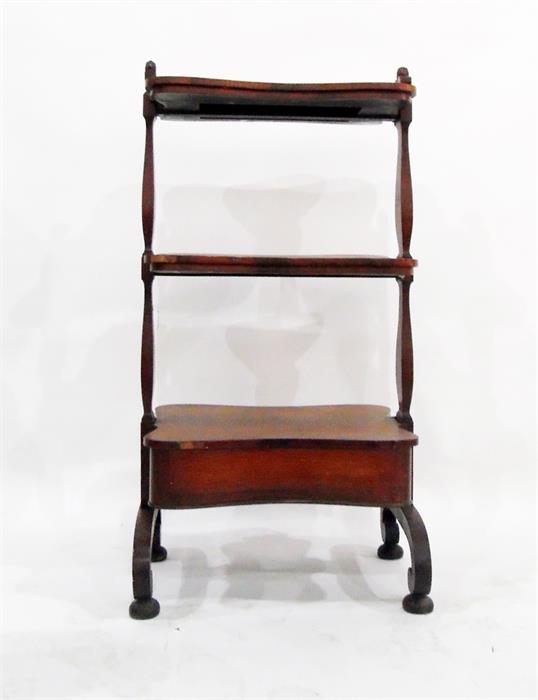 19th century rosewood three-tier whatnot fitted a drawer to base, on scroll bridge supports and
