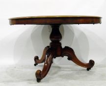 Victorian mahogany pedestal table on three swept shaped supports with scroll toes, on brass castors,