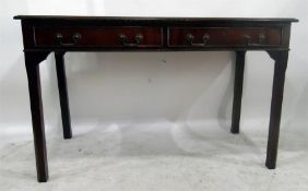 Mahogany writing table having tooled leather inset writing surface and fitted two drawers to frieze,