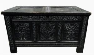 Oak coffer with panelled top and carved panelled sides, on straight supports, 101cm wide