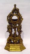 Early 19th century giltwood pocket watch stand with rococo style decoration with scrolls and