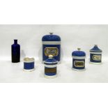 Five various ceramic pharmaceutical jars and a blu