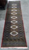 Turkish wool runner labelled to reverse, multi border with beige lozenges to centre, 285cm x 81cm