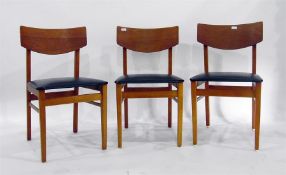 Three laminated teak-finish dining chairs with black vinyl covered seat pads (3)