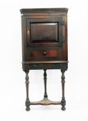 18th century oak corner cupboard on stand, with dentil cornice, fielded panel cupboard door with