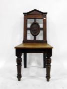 Early 19th century oak open arm elbow chair with shaped crest rail and pierced vase-shaped splat and