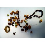Quantity of loose assorted butterscotch and red amber beads, various sizes