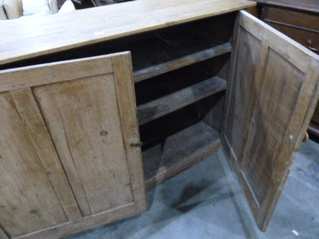 19th century dwarf pine kitchen cupboard enclosed by a pair of panelled doors, on plinth base, 152cm - Image 2 of 6