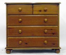 Pine chest of two short and three long drawers, each with turned knob handles, 85cm wide