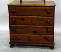 Modern pine four-drawer chest, each with turned knob handles, 86cm wide