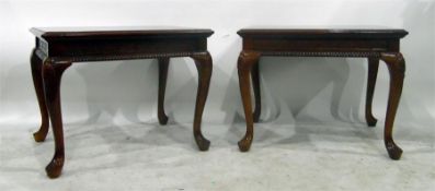 Pair of mahogany lamp tables with gadrooned carved frieze, on shell carved cabriole supports, each