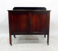 Mahogany side cupboard with pair panelled doors enclosing shelf, on square legs with castors, 91cm