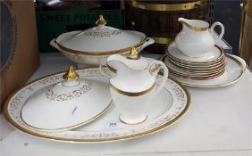 Royal Doulton 'Royal Gold' lidded tureen, large serving platter, jug, two-handled covered dish and