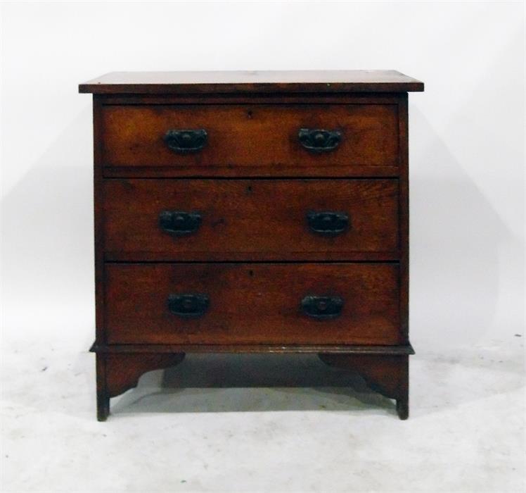 Oak chest of three drawers with oxidised metal handles, on bracket style feet (formerly a dressing