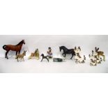 Beswick horse, another, a Beswick foal, a Beswick model of a donkey, a figure of a fawn (damaged)