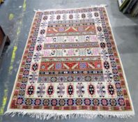 Persian style wool rug, cream ground with purple, pink and red decoration, floral and bird motifs to