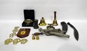 Quantity of metalware to include horse brasses, bell, kukri knife, 'The ACME' corkscrew and other