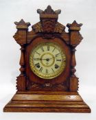 American carved oak mantel clock by the Ansonia Clock Company, New York, having eight-day gong