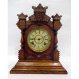 American carved oak mantel clock by the Ansonia Clock Company, New York, having eight-day gong