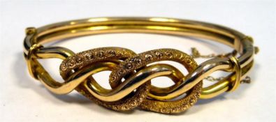 9ct gold bangle with wavy decoration, makers 'M&J', marked 9ct, 12g