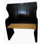 Old black painted panel back settle with downswept arms, on stile supports, width 92cm