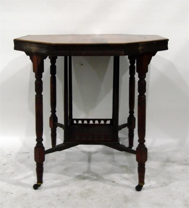 Edwardian walnut octagonal-top table, on ring turned supports, the cross-stretcher with under-shelf,