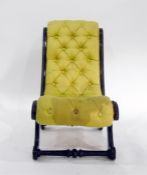Victorian ebonised button upholstered nursing chair with scrolled frame