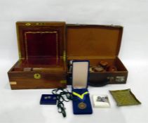 Leather suitcase enclosing assorted collectable items to include coins, tray, hand-held compass, etc