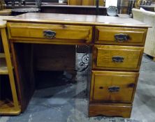 Varnished pine kneehole single pedestal desk having an arrangement of four drawers, 95cm wide