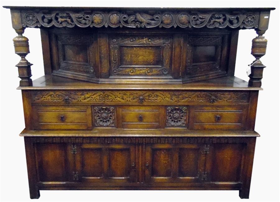 Early 19th century oak reproduction court cupboard, having carved guilloche style canopy, with