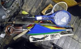 Various squash racquets, a Slazenger 600 cricket bat, a Pro-Spec hockey stick and a shooting stick