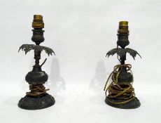 Pair of brass table lamps with leaf decoration, on circular bases, 25cm high (2)