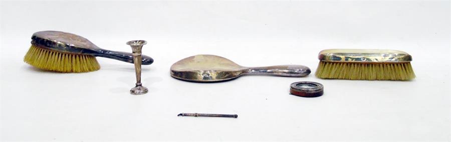 Early 20th century three-piece silver-mounted dressing set comprising of two brushes and a mirror,